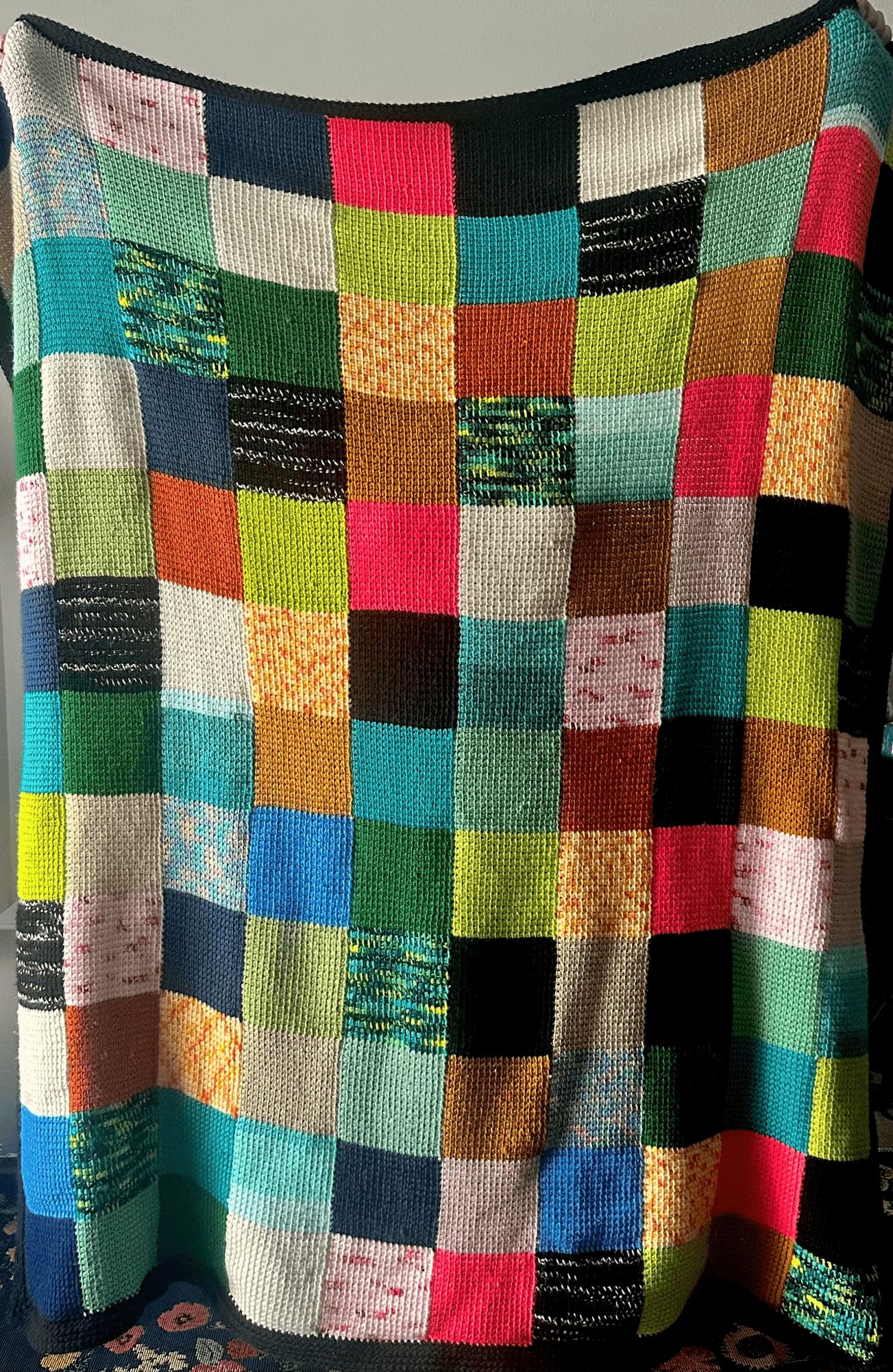 scrappy_tunisian_checkboard_blanket.jpga checkerboard Tunisian crochet blanket in a mismatched variety of colors